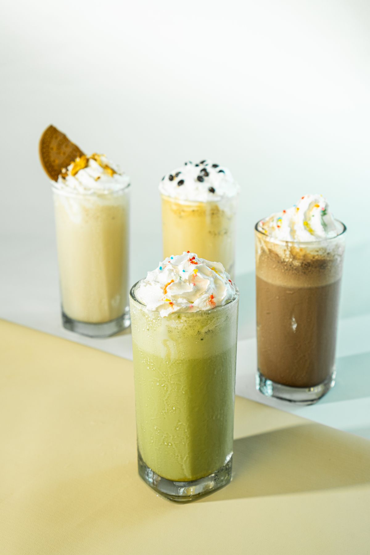 Four brightly lit frozen shakes